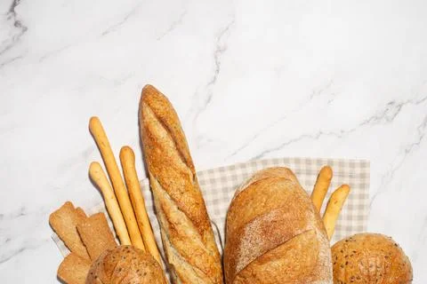Background with different types of fresh bread. Bakery products. Cooking. Stock Photos