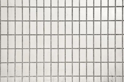 Background from dirty rectangular ceramic tiles on cement base Stock Photos