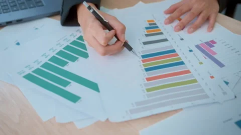 Background of documents with analytics data lying on table Video stock 205501389