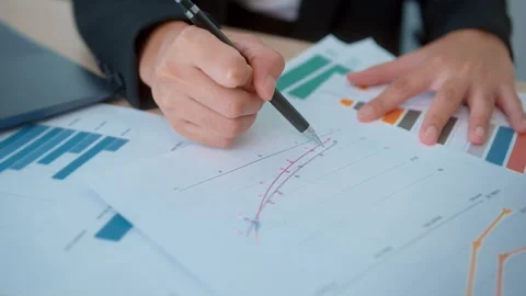 Background of documents with analytics data lying on table Stock Footage 205501393