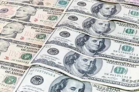 Background of dollar banknotes laying in a row Stock Photos
