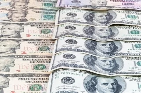Background of dollar banknotes laying in a row Stock Photos