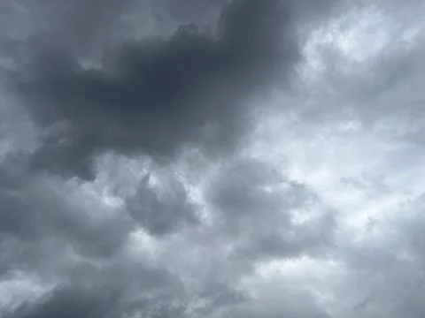 Background of dramatic cloudy sky with dark clouds Stock Photos