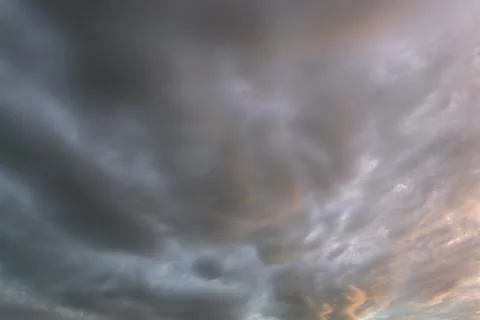 Background of dramatic sky with dark clouds. Stock Photos