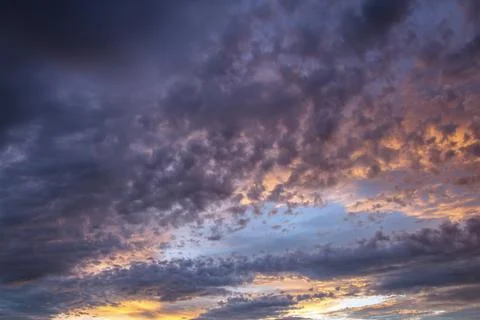 Background of dramatic sky with dark clouds. Stock Photos