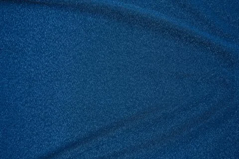 Background of draped dark blue fabric with silver lurex thread Stock Photos