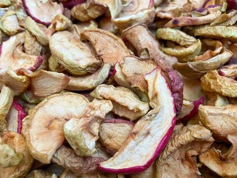 Background of dried apples in close-up. Texture of dried apples Stock Photos