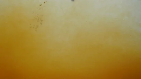 Background dropping coffee powder into the water splashing beautifully Stock Footage 100371936
