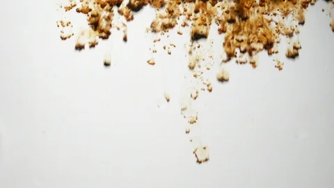 Background dropping coffee powder into the water splashing beautifully Stock Footage