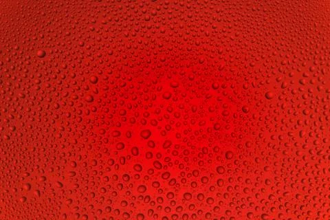 Background from drops of the different size on red glass Stock Photos
