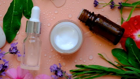 Background with drops of water cream moisturizing and flowers. Selective focus. Stock Footage 203186814