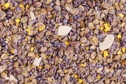 Background of dry breakfast with mango and passion fruit slices, macro Stock Photos