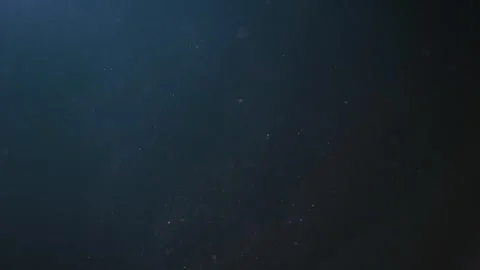 Background of dust flying in the air, small particles moving slowly on a da.. Video stock 267071135