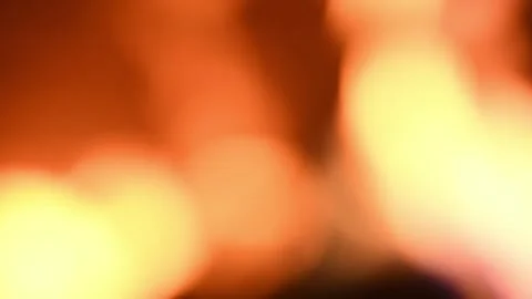 A background of dynamic glare and bokeh from the movement of dancing flames. Stock Footage 328474187