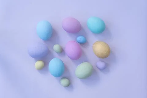 Background for Easter. Easter eggs are laid out on a gentle blue background Stock Photos