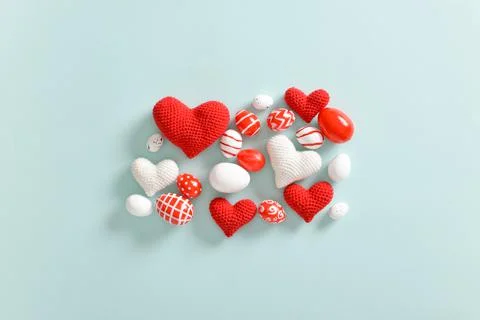 Background with Easter eggs in red and white. Copy space. Flat lay, top view. Stock Photos