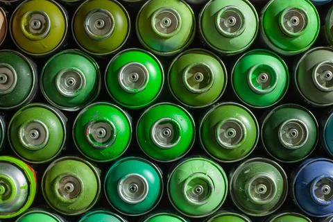 Background of empty cans of paint for graffiti. Tools for street art Stock Photos
