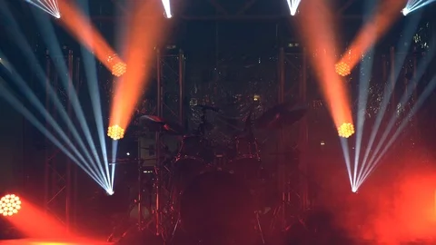 Background of an empty small stage with drums and lighting, repeatable Stock Footage 119792826