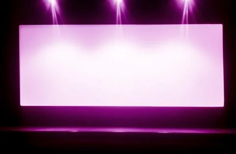 The background of the empty white screen above the stage under the spotlights Stock Photos