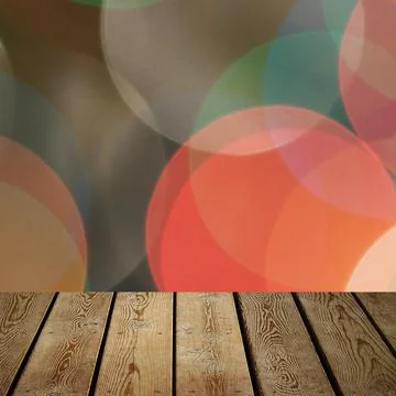 The background is an empty wooden board and a wall of blurred bokeh lights. Stock Photos