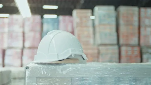 Background of engineering helmet in modern warehouse storage of retail shop Видео 204918787