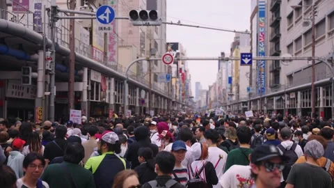 Background establishing shot of crowd on busy day for cosplay festival Stock Footage 311456755