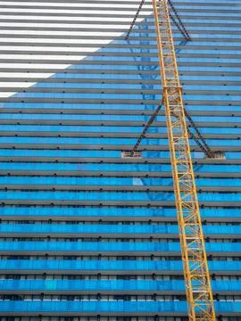 Background from the facade of a modern multi-storey building. Construction .. Stock Photos