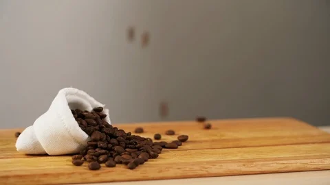 Background fall coffee bean slowmotion lie white bag roast arabica closeup Stock Footage 113078598