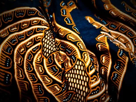 The background features a classic Sogan batik motif Stock Photos