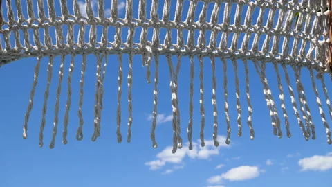 Background featuring a detailed view of a stylish woven cotton parasol Stock Footage 337493563