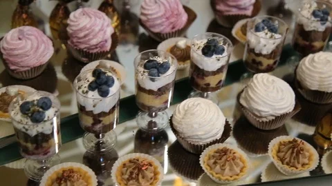 Background filled with colorful cakes and desserts with fresh fruits Stockbeeldmateriaal 123700973