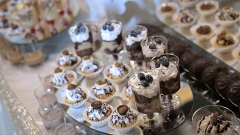 Background filled with colorful cakes and desserts with fresh fruits Stockbeeldmateriaal 123701088