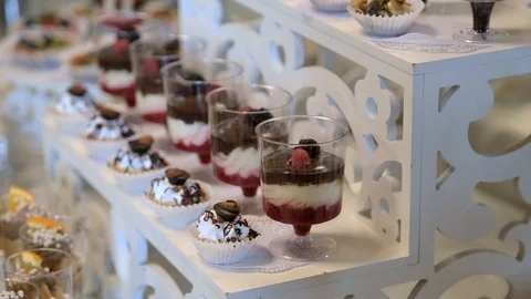 Background filled with colorful cakes and desserts with fresh fruits Видео 123701275