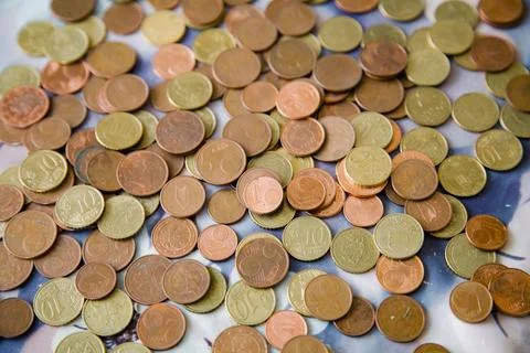 A background filled with small euro cent coins Foto stock