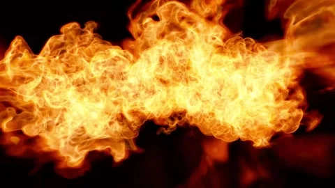 A background of fire. Powerful flames rush into the camera against a black Video stock 240281359