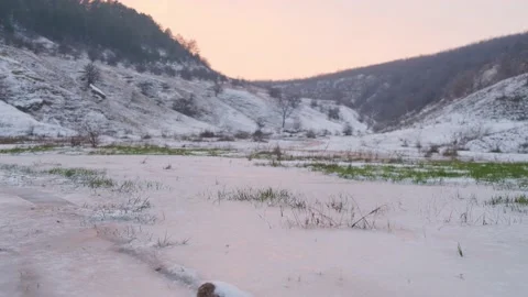Background with the first snow falling on the green grass. Winter has come. Stock Footage 165287476