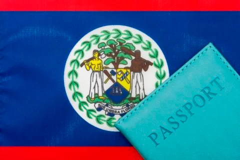 On the background of the flag of Belize is a passport. Stock Photos