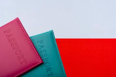 On the background of the flag of Poland has two passports. Stock Photos