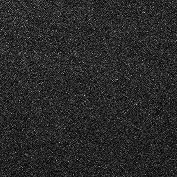 The background of the foam is black.The substrate is made of black foam rubber. Stock Photos