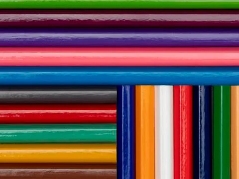 Background in the form of colored pencils. Geometry. All over the plane. Stock Photos