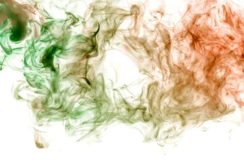 Background in the form of a pattern of colored green and red smoke in the sha Stock Photos