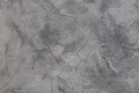 Background in the form of a surface with gray plaster. Stock Photos