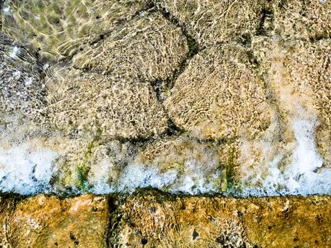 Background formed by the water of a stream. Stock Photos