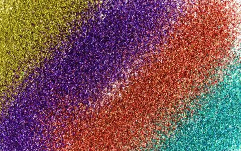 Background from four strips of a multi-colored glitter. Stock Photos