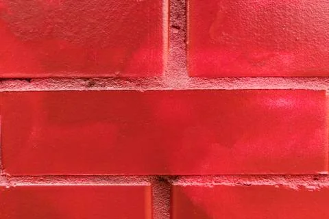 Background of fresh brickwork, painted in red. 库存照片
