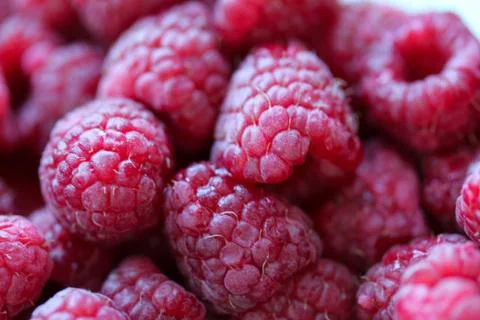 Background with fresh raspberry closeup Stock Photos