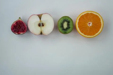 Background of fresh sliced fruit on a table in the afterno Stock Photos