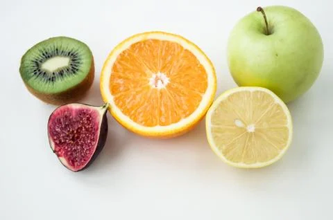 Background of fresh sliced fruit on a table in the afterno Stock Photos