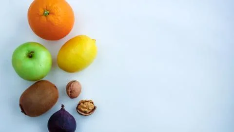 Background of fresh sliced fruit on a table in the afterno Stock Photos