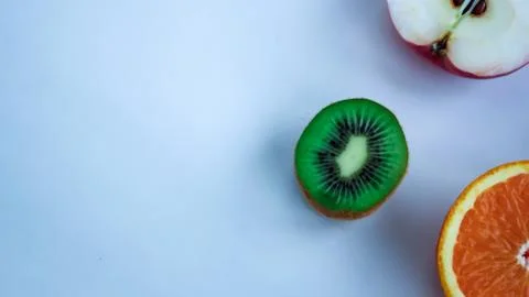 Background of fresh sliced fruit on a table in the afterno Stock Photos